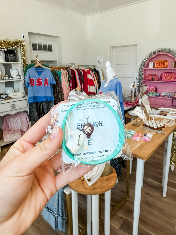 Mini Jesus figuring + Bracelet combo pack in teal inside Nocona boutique