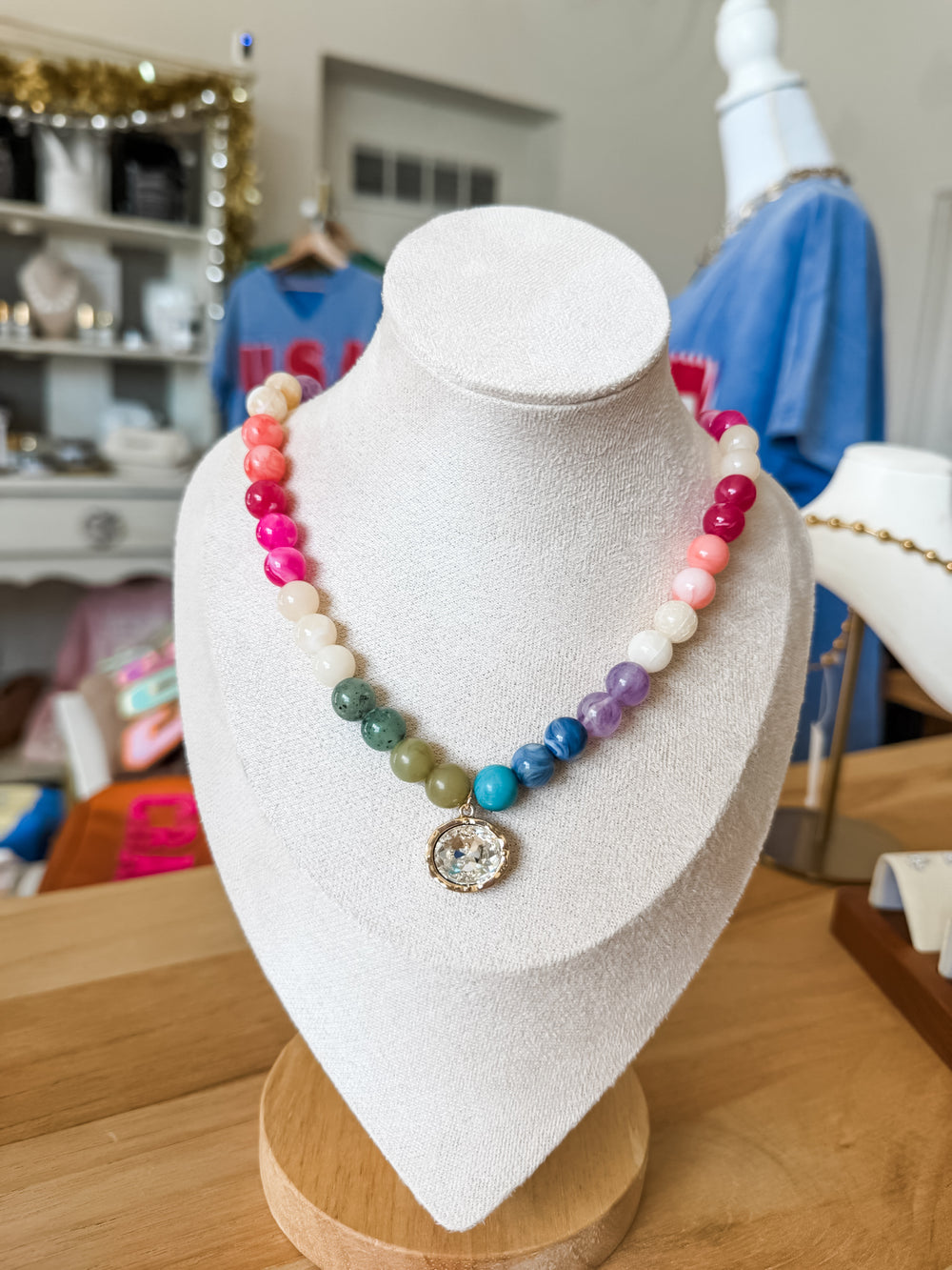 Multi colored beaded necklace with crystal pendant 