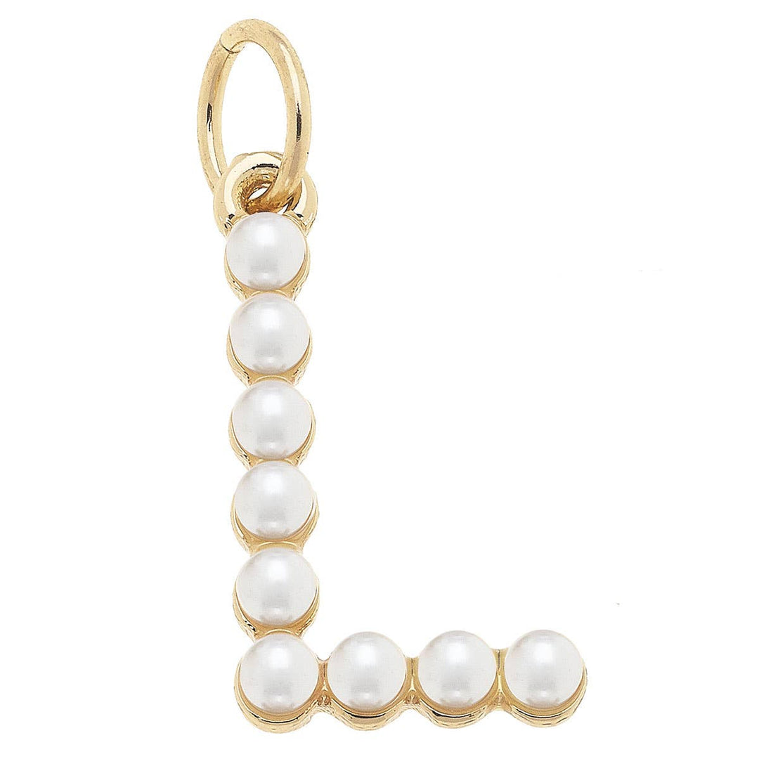 A gold-plated letter charm with ivory pearls studded on it.