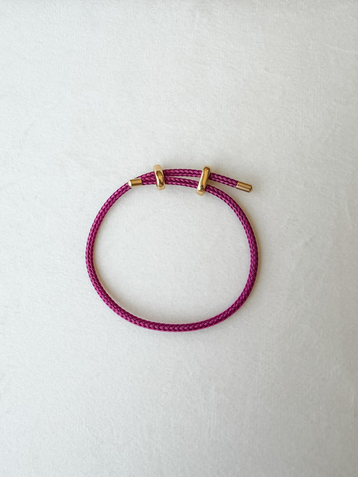 Raspberry adjustable para cord bracelet with gold accents