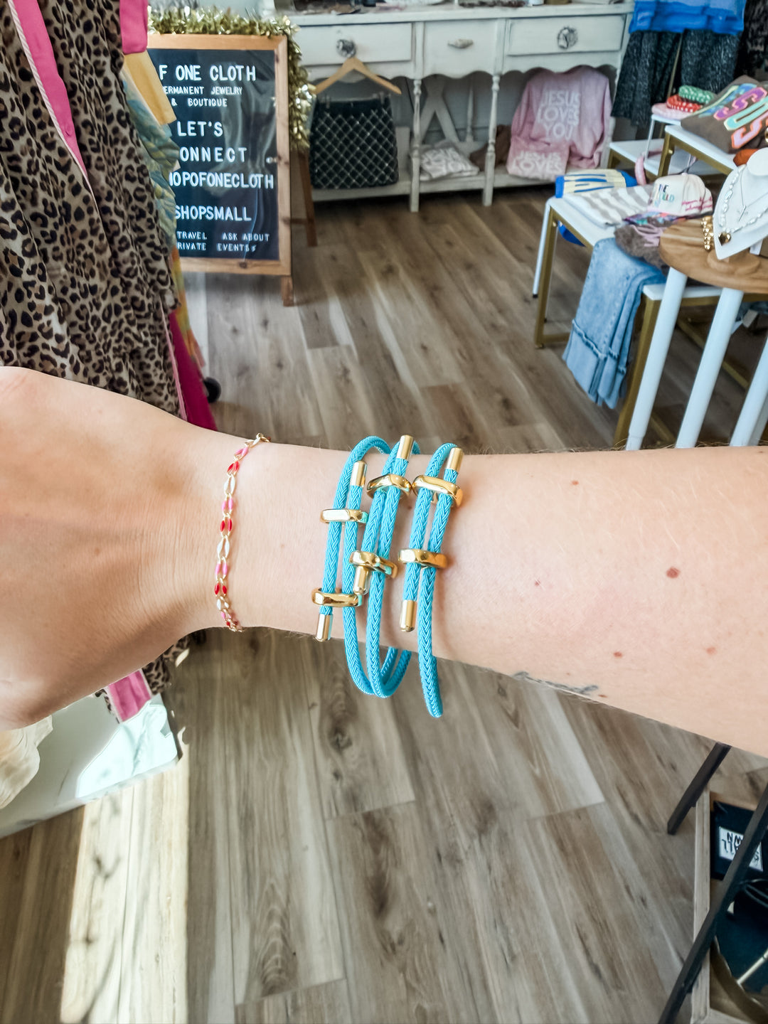 Three turquoise paracord bracelets on wrist