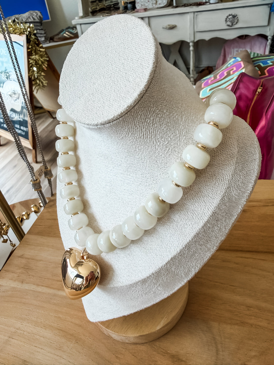 White beaded chunky necklace with gold heart pendant 