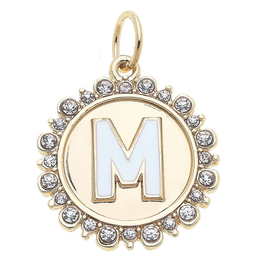 A shiny gold letter 'M' charm adorned with rhinestones.