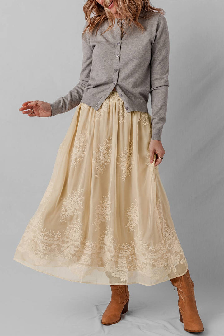 Woman wearing a beige lace skirt 