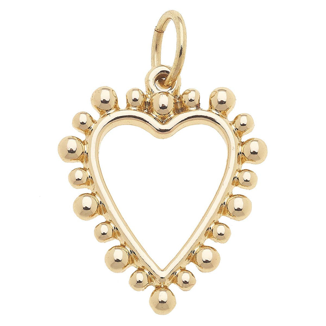 A shiny gold open heart-shaped charm with small studs around the perimeter.