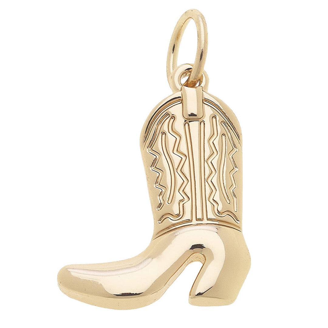Gold cowboy boot charm on a white background