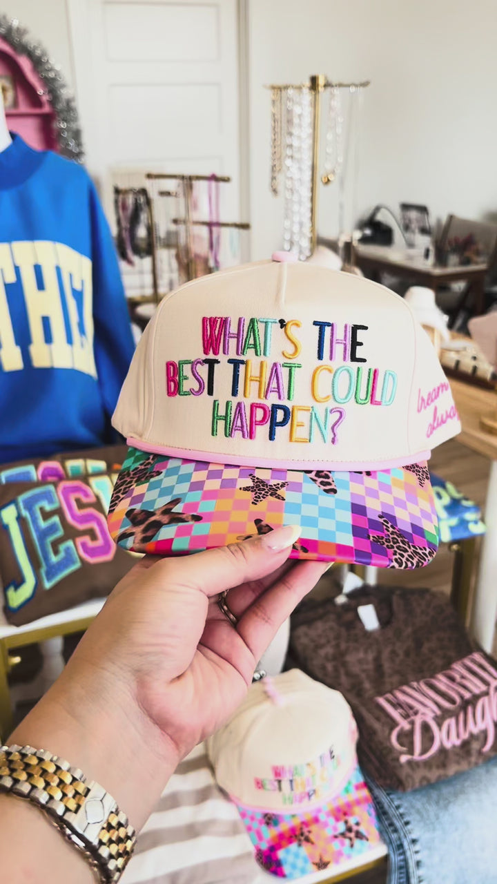 Video of adjustable trucker hat with colorful text on front "What&