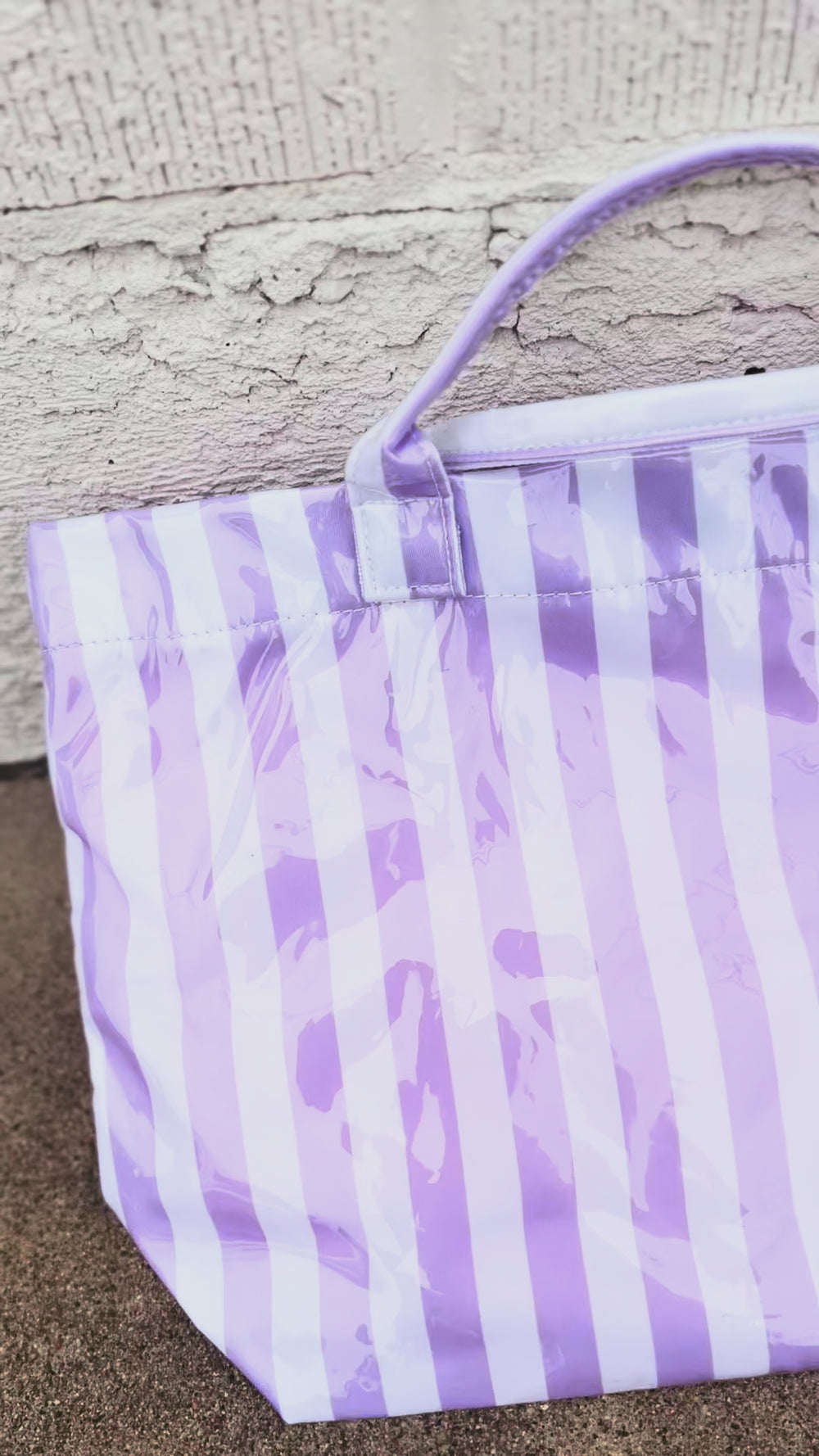 video of purple and white striped tote