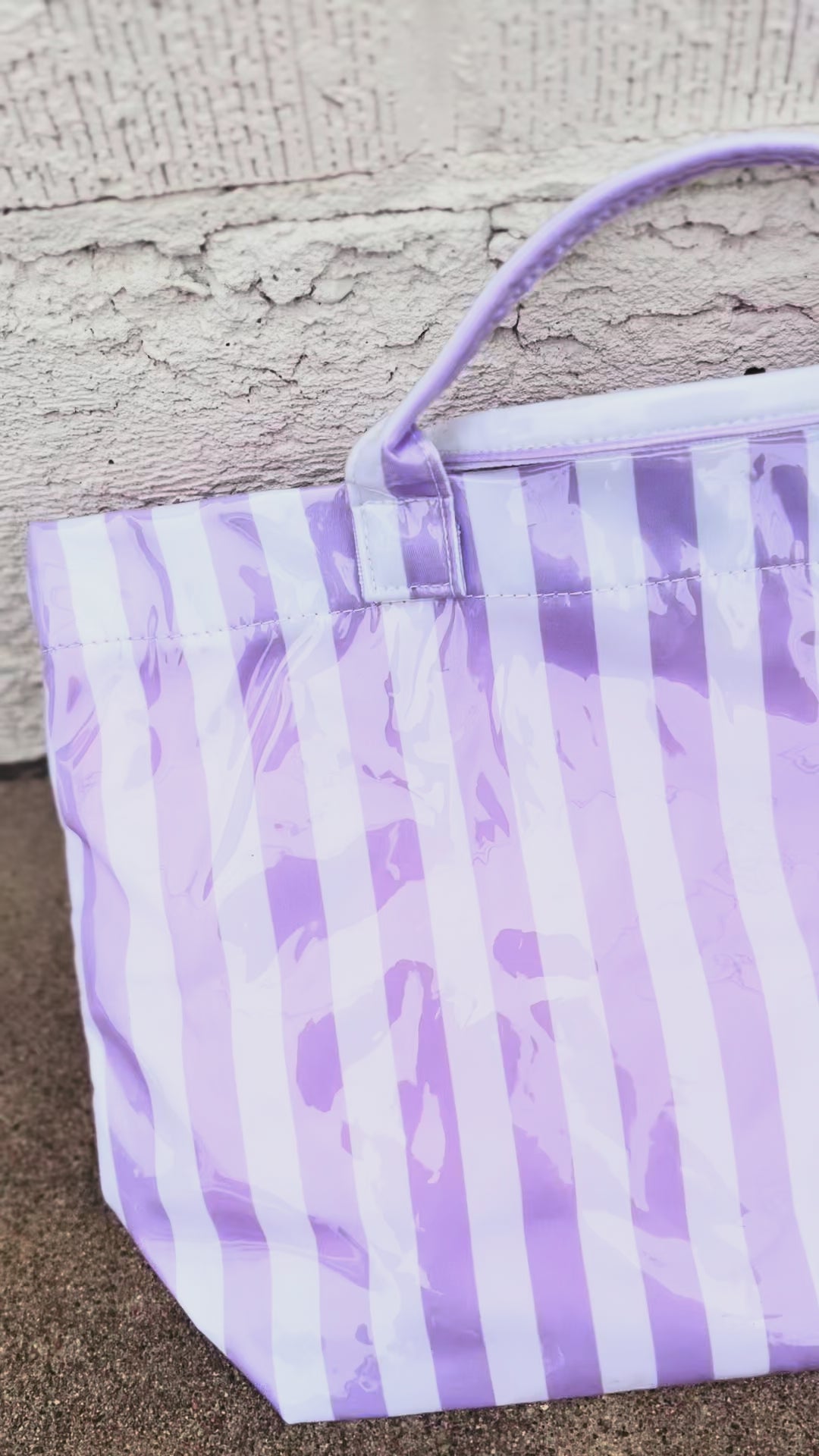 video of purple and white striped tote