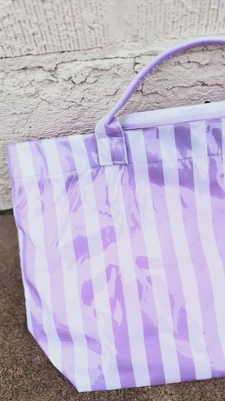 video of purple and white striped tote