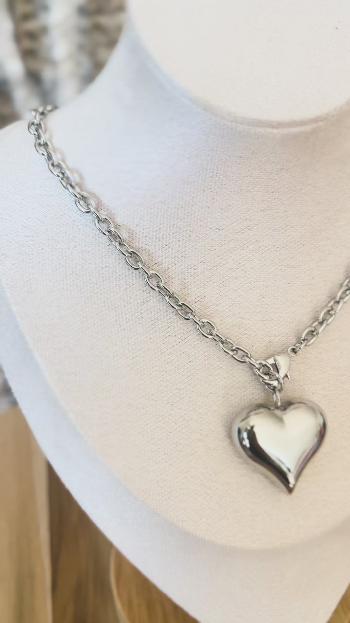 Video of stainless steal silver necklace with heart pendant