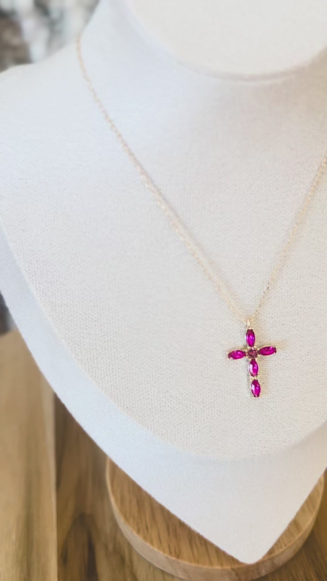 Video of Gold necklace with fuchsia cross pendant