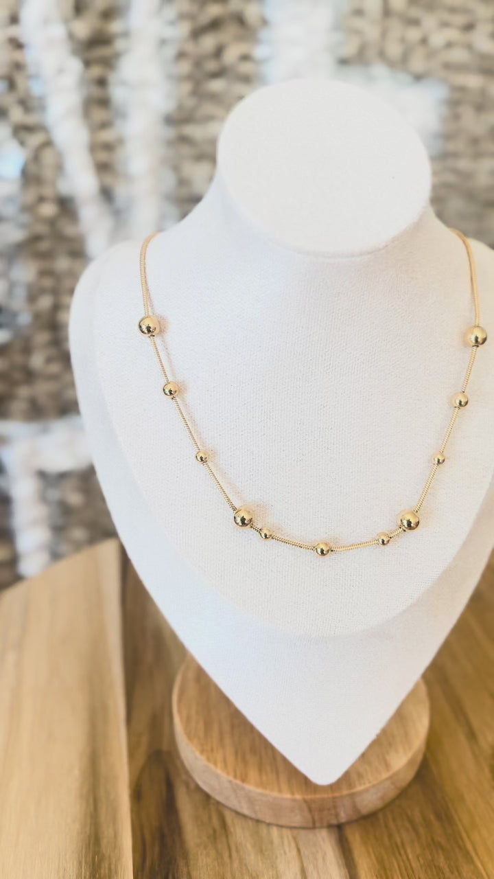 Video of gold chain with gold ball accents necklace