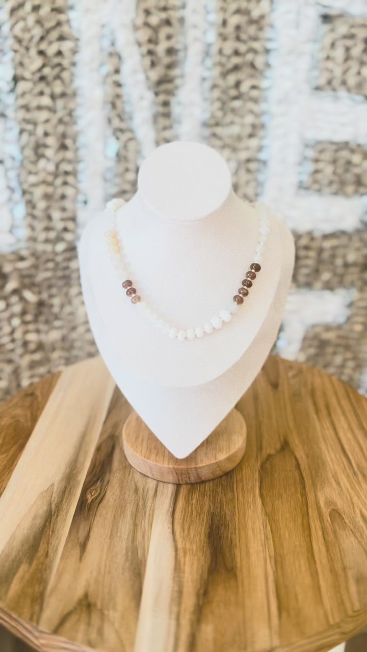 Video of brown, white, cream beaded necklace