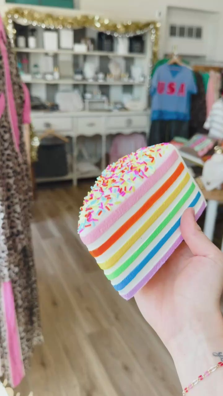 Hand squeezing cake slice shaped squishy