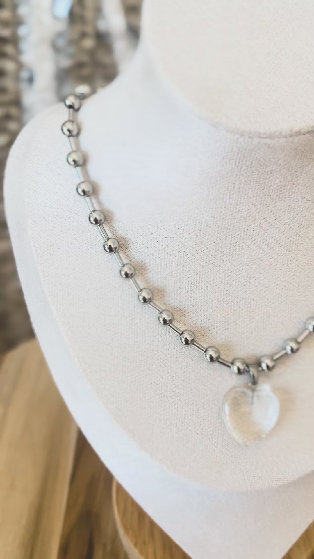Clear heart pendant on silver necklace