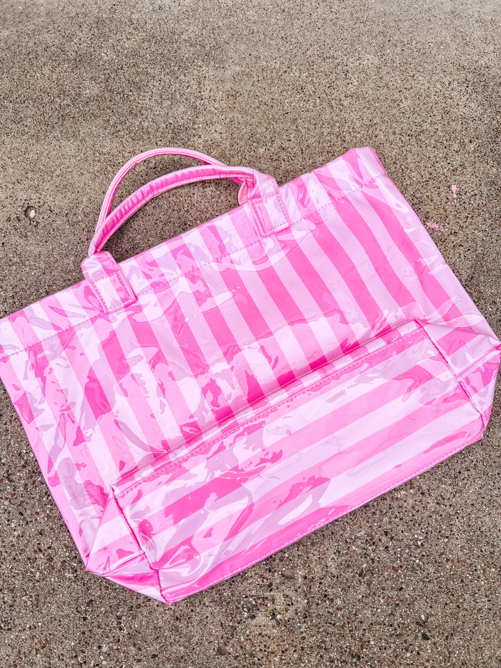 back side of light and dark pink striped tote